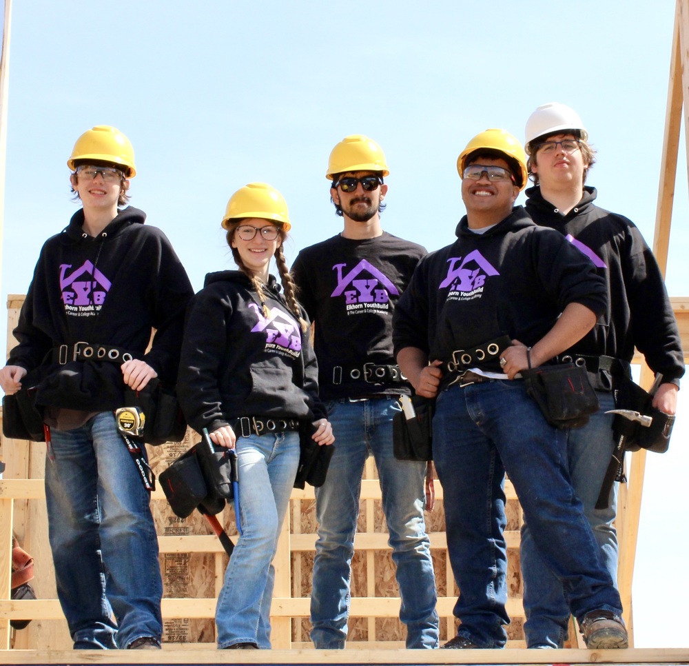 YouthBuild Students posing at a construction site
