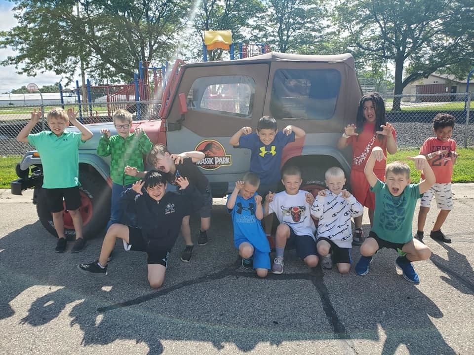 Jackson elementary students in front of Jurassic Park jeep
