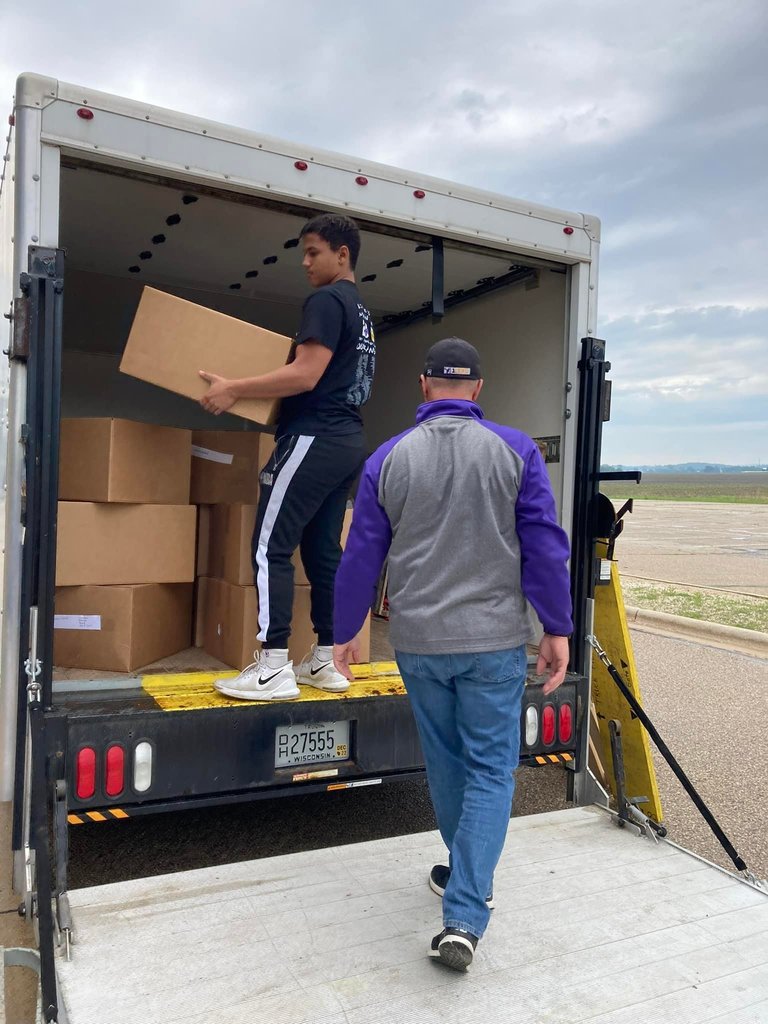 EAHS student unloading box from van